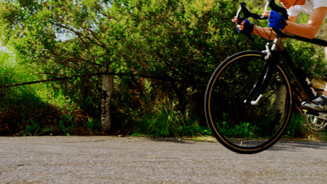 senior cyclist cycling on a road 4k