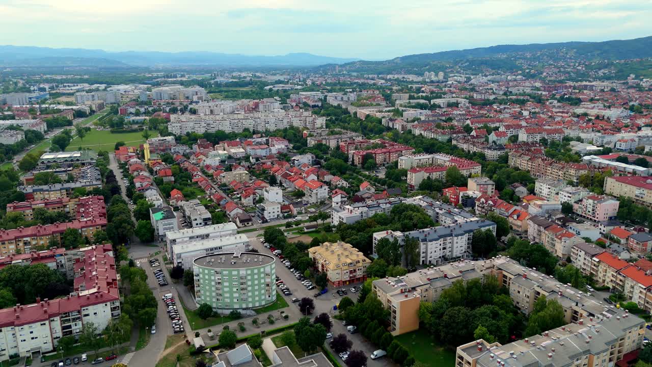 Aerial drone view of Zagreb skyline modern buildings, and warm evening light over Croatia’s capital city