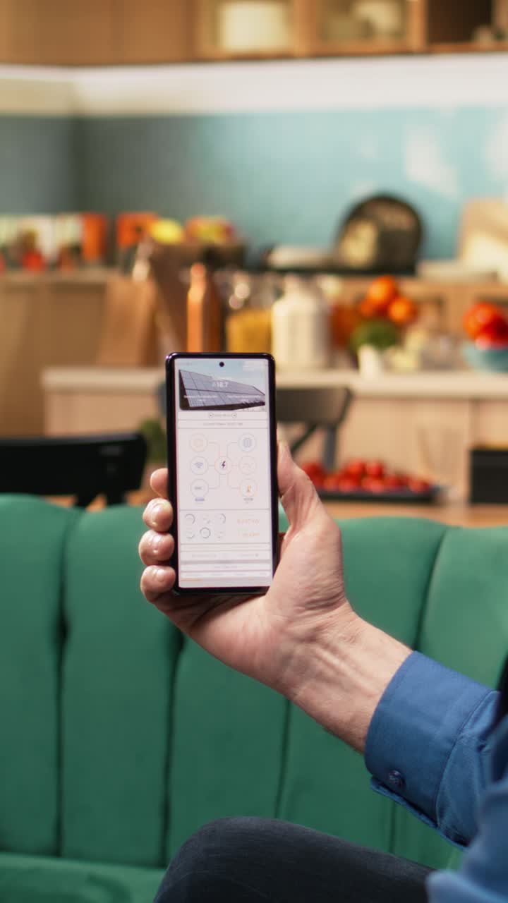 Vertical Video Aged man and woman reviewing green energy system through software
