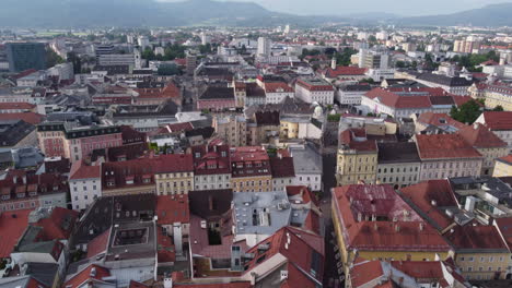 Klagenfurt,-Austria,-City-Surroundings-Aerial-Reveal,-Tilt-Up-Dolly-In