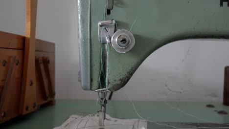 Close-up of a vintage Refrey sewing machine in use in a cozy room