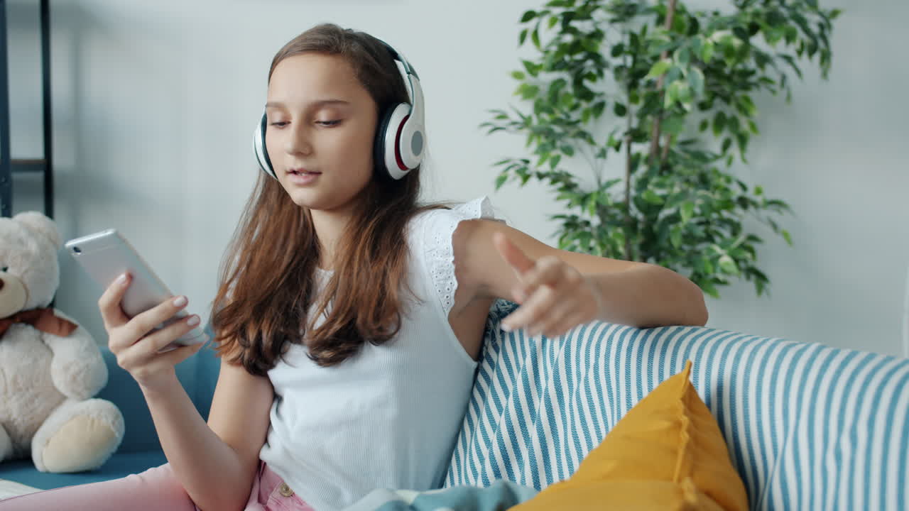 Teenage Girl Listening to Music on Phone