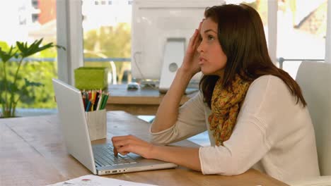 Pretty-girl-focusing-on-her-laptop