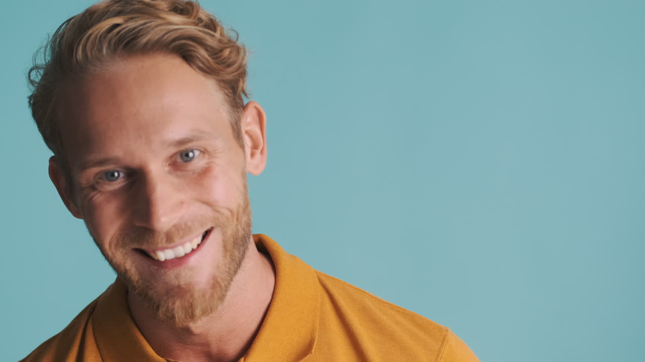 Happy and surprised bearded man posing