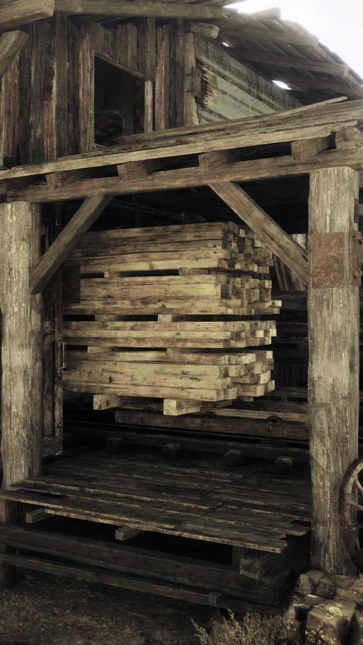 Rustic wooden structure with stacked pallets in a historical setting