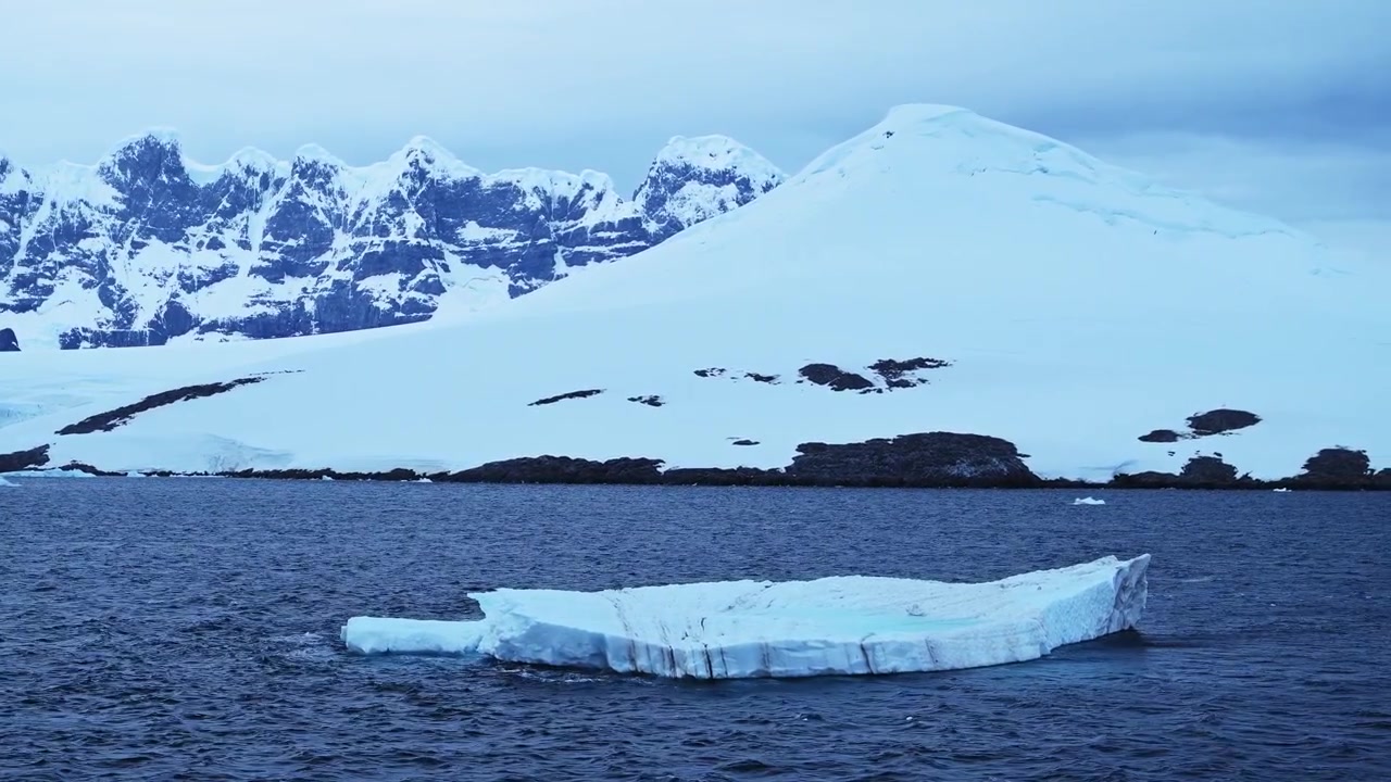 Coastal Mountains in Winter Ocean Landscape, Antarctica Iceberg and Sea, Beautiful Dramatic Dark Moody Blue Coastal Seascape on Antarctic Peninsula Coast, Icy Winter Sea Scene with Ice