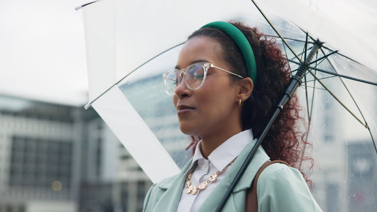 Woman with clear umbrella in the city