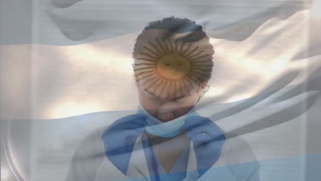 animation of flag of argentina with gloved female doctor putting on face mask