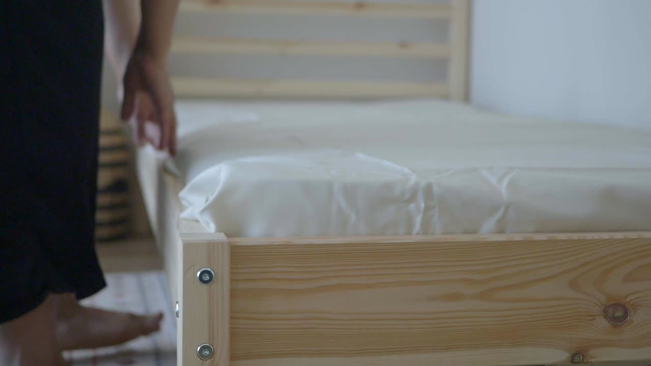 Person making a bed