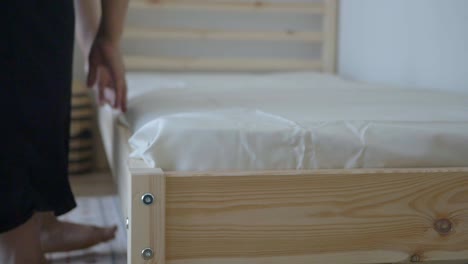 person making a bed