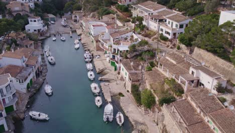 flying over port de cala figuera mallorca with no people, aerial