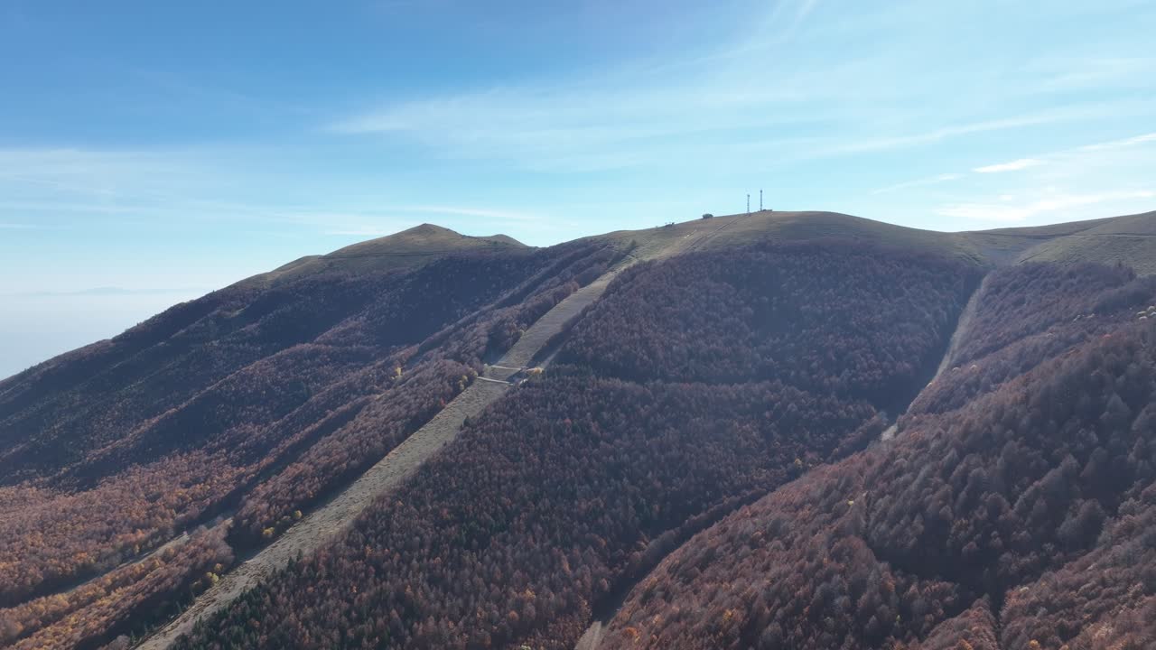 Mount Vermio’s forested slopes, ski trails, and rugged ridges under a clear blue sky. Greece