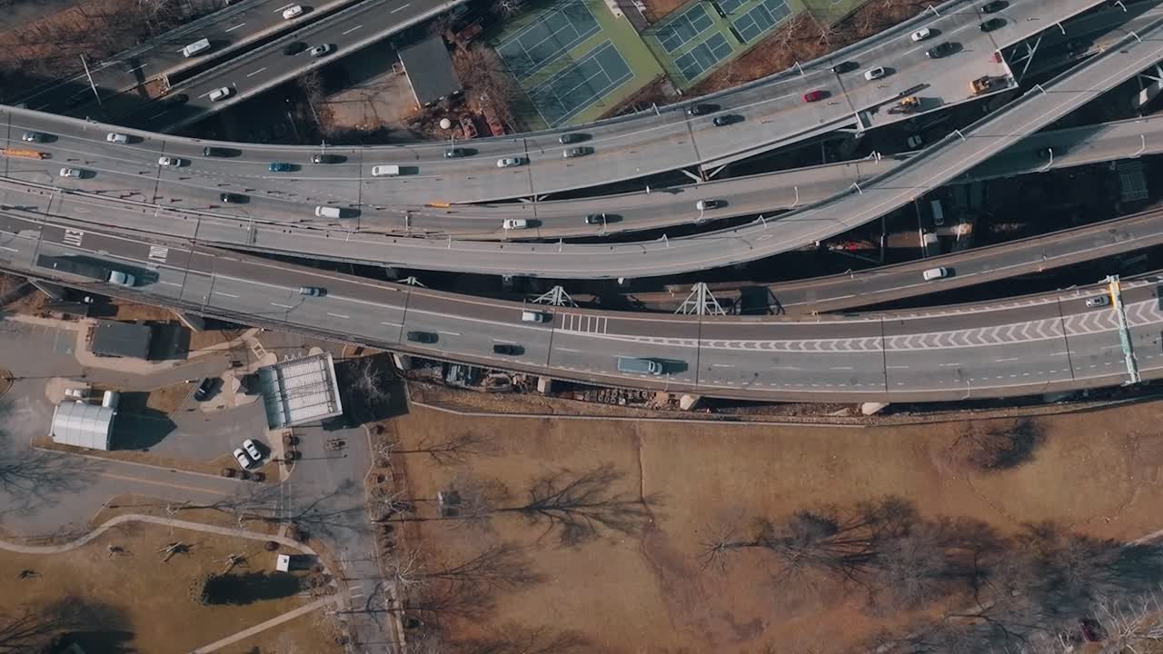 Traffic flows over roads in New York with parks and buildings nearby