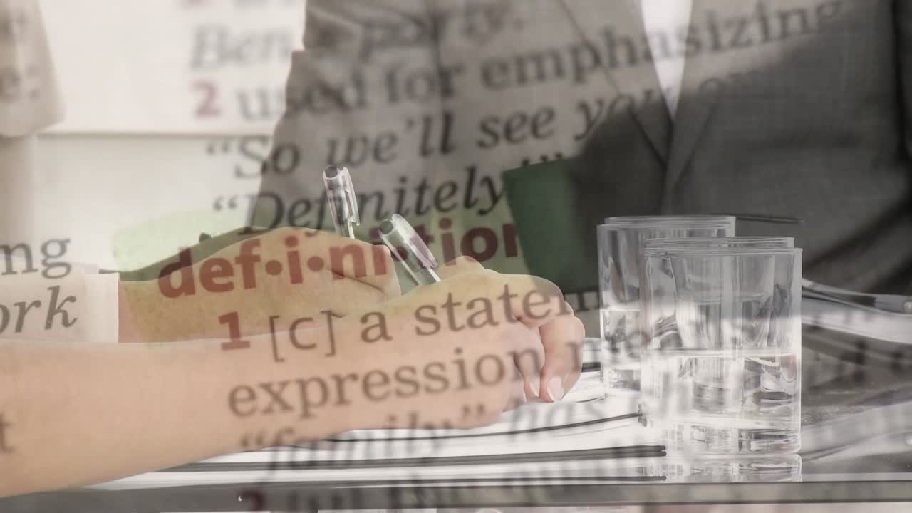 Animation of texts over diverse business people having meeting at office