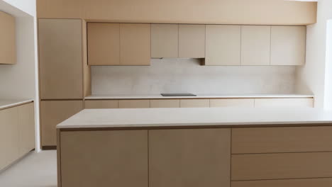 modern minimalist kitchen interior with beige cabinets and island