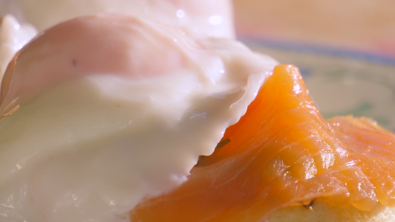 Pan Across Delicious Breakfast of Crumpet with Smoked Salmon Topped with Poached Egg. Morning High Protein Healthy Stylish Food Brunch Footage 4K.