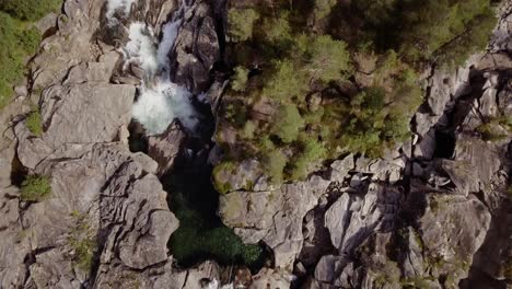 Top-shot-of-a-small-river-with-rapids-and-pools-in-northern-Norway