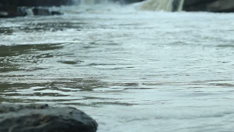 serene river flowing over rocks