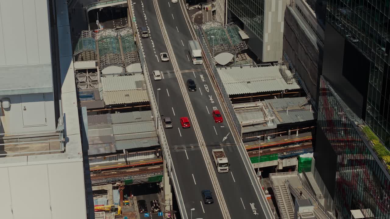 Aerial View of City Road with Cars and Buildings