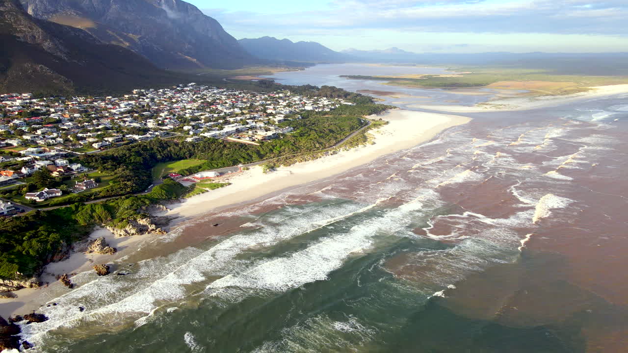 Discolored brown water in Walker Bay Hermanus after heavy rains. Aerial