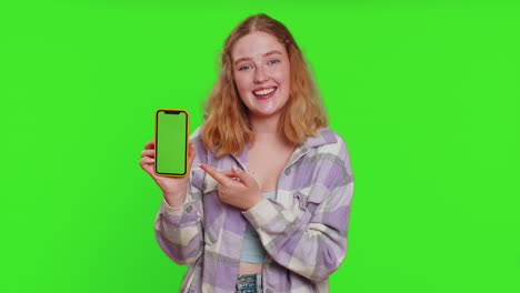 developer woman girl hold smartphone with green screen chroma key mock up recommend good application