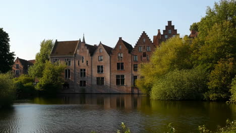 historic european buildings reflected in canal