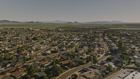 scottsdale arizona aerial v1 panoramic panning view above chateau de vie neighborhood capturing tillable farmland, cityscape of desert city, camelback mountain - shot with mavic 3 cine - february 2022