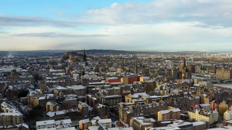 Aerial-shot-flying-over-snowy-Edinburgh-on-a-sunny-winters-day