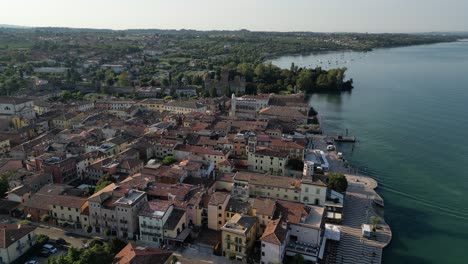 sweeping aerial footage of charming italian sea-side town and the horizon