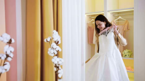 caucasian woman in wedding dress shop