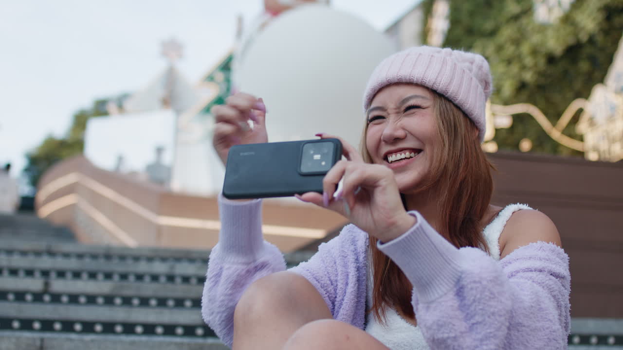 Woman taking a photo with her cellphone