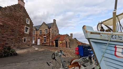 boats and historic buildings in crail, scotland