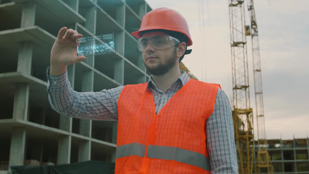 Architect or Engineer using smartphone transparent hologram digital display applicatiion in front of building under construction. Technology, people.