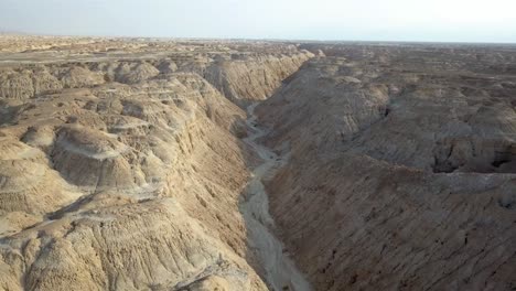 aerial view over large wadi with soft sedimentary rock, arava desert