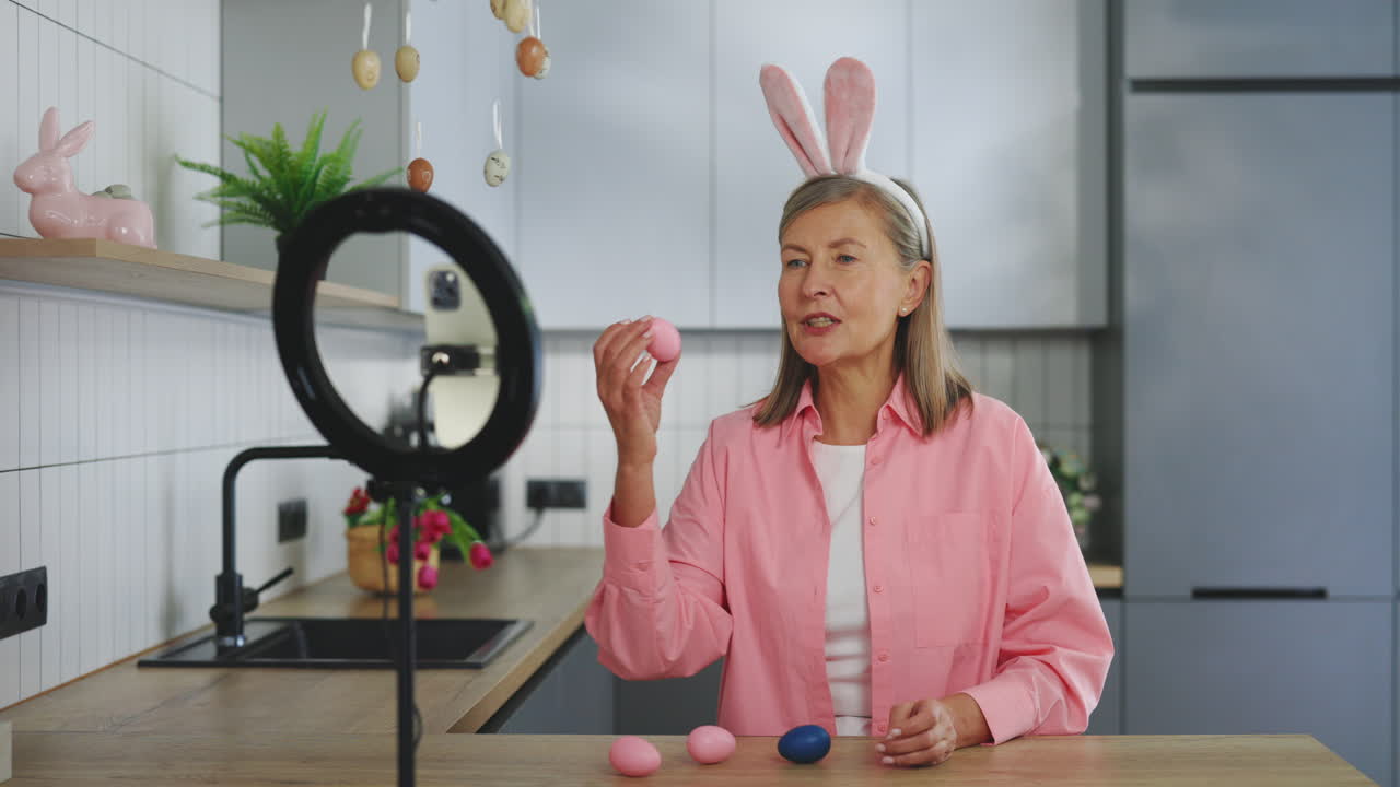 Senior Woman Demonstrating Easter Egg Decoration Tutorial