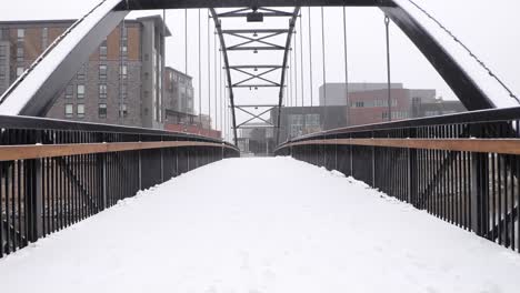 snow covered city bridge during fresh snowfall