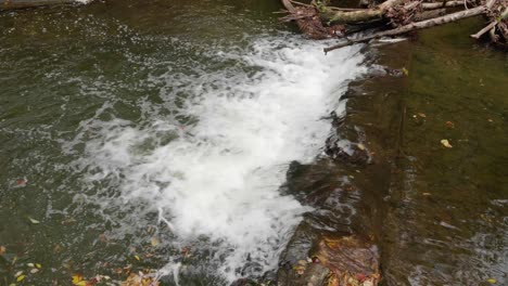 Waterfall-near-Covered-Bridge,-Thomas-Mill-at-the-Wissahickon-Creek