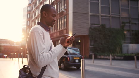 city, man and phone or working on social media