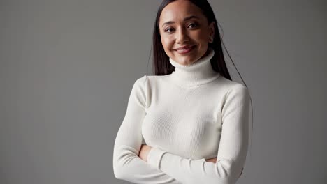 smiling woman in white turtleneck