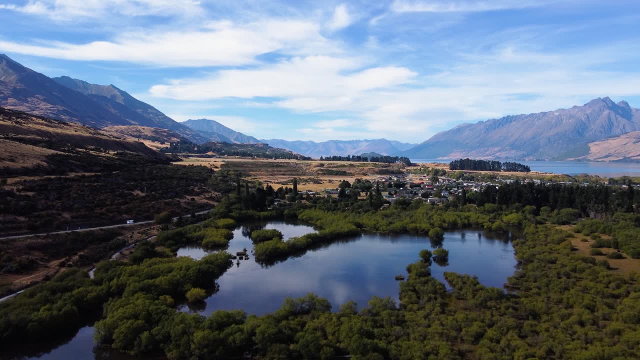 AERIAL Shot of Swampy Lakes in a Stunning Mountain Landscape in New Zealand