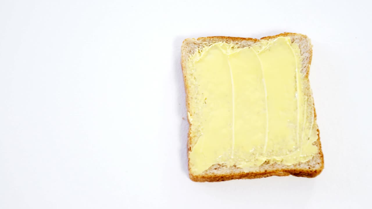 Butter spread on bread slice