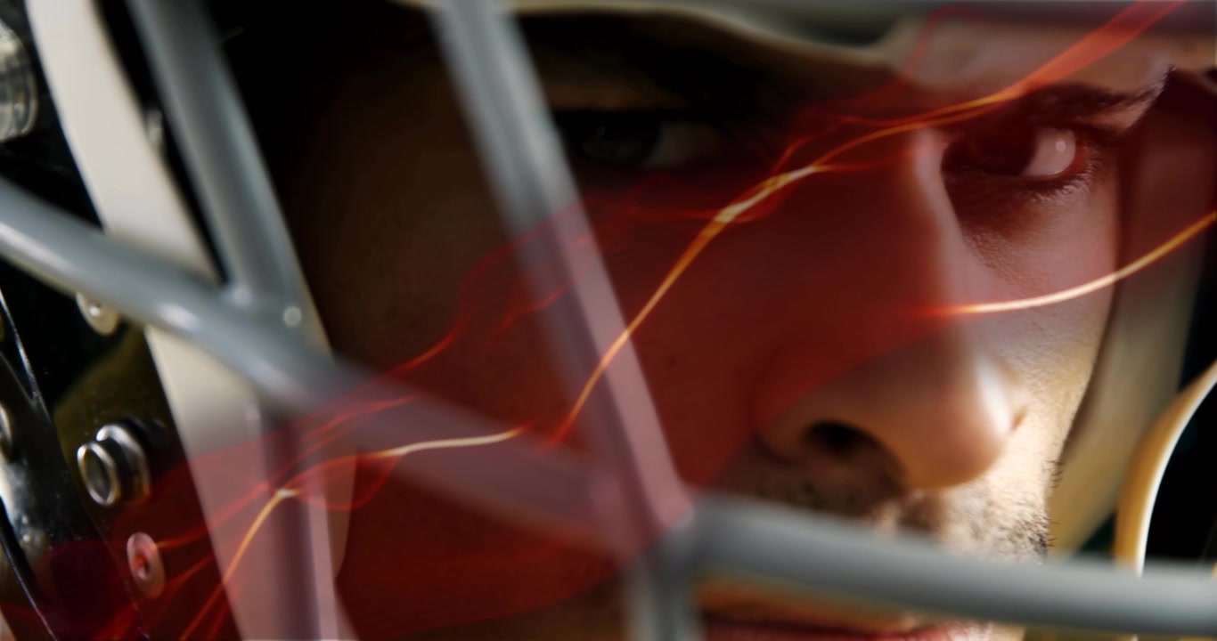 Sentendo il segnale del compagno di squadra, giocatore di hockey che osserva usando tecnologia sportiva, con strisce rosse che migliorano la concentrazione.