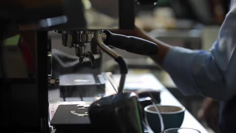 barista making coffee in a restaurant