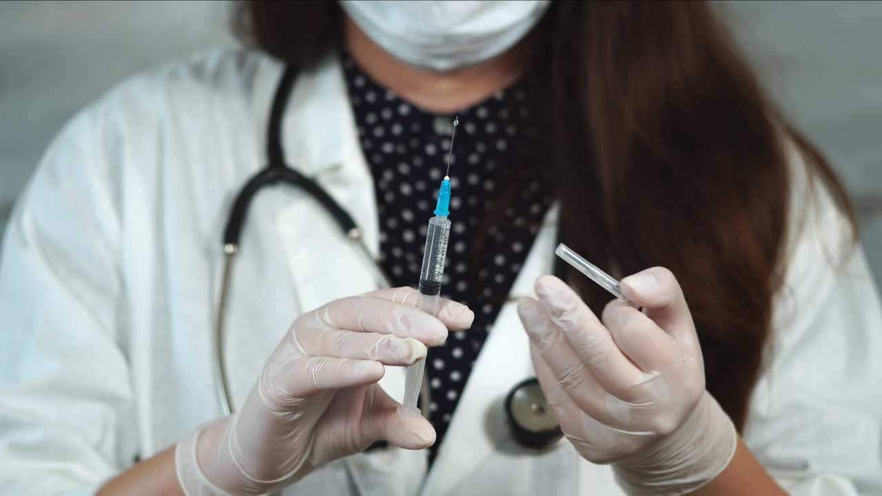 Doctor administering injection