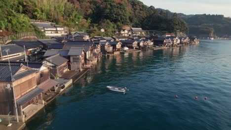 aerial panoramic drone of japanese kyotango beach boat houses location blue sea ine town inecho