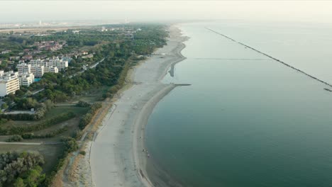 aerial shot of sandy beach with umbrellas, typical adriatic shore