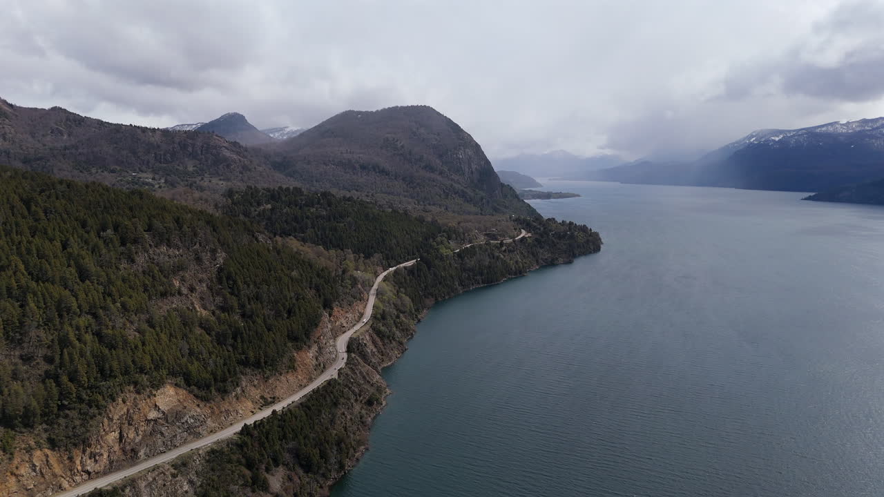 Aerial View of Scenic Lake and Mountain Road