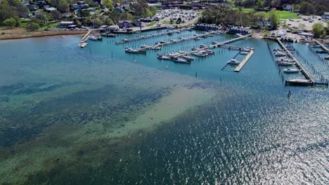 marina with moored boats near askimsbadet beach in gothenburg, sweden. aerial drone shot