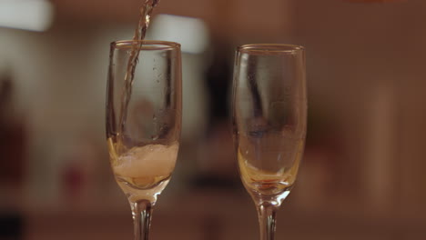 champagne pouring into glasses