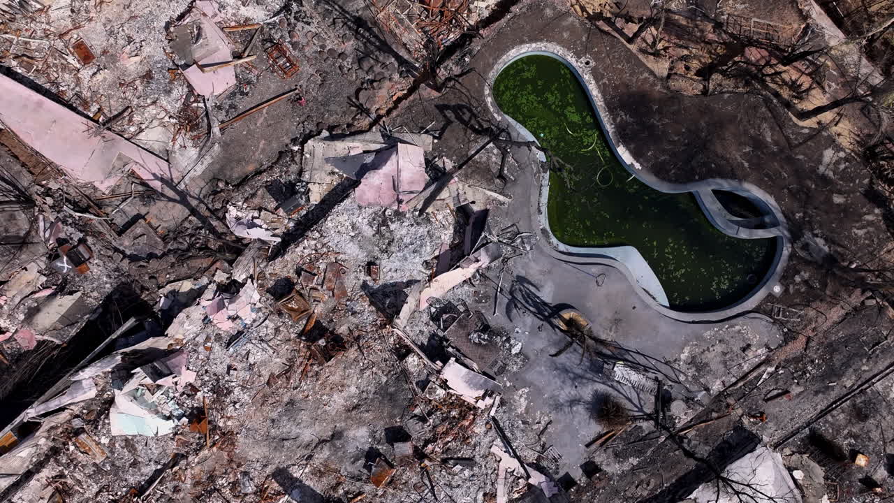 Aerial View of Extensive Destruction and Burnt Buildings After a Disaster